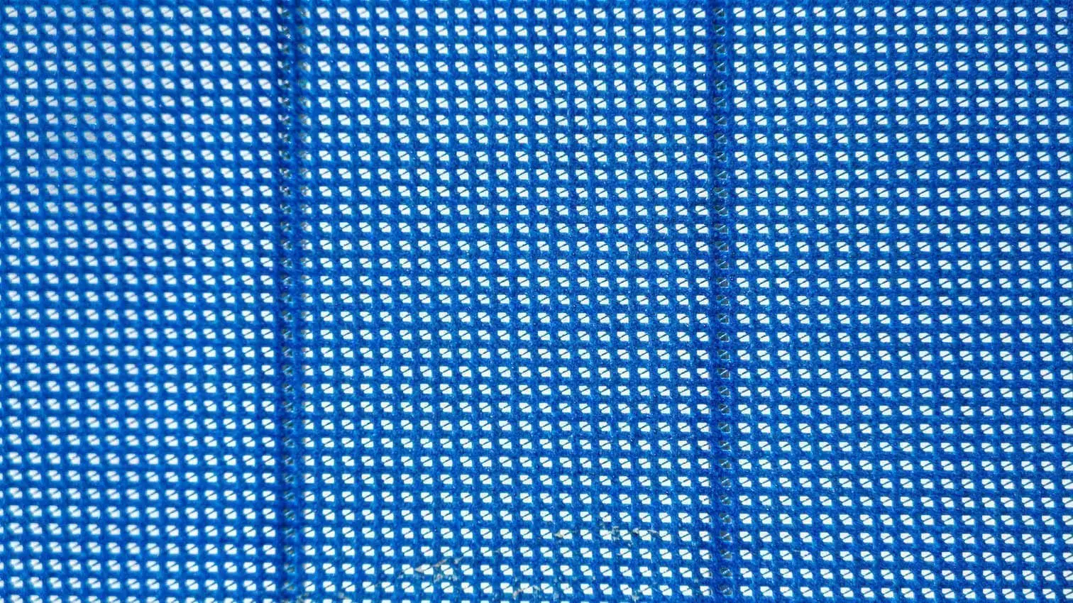 zoomed in view of blue material for a privacy fence